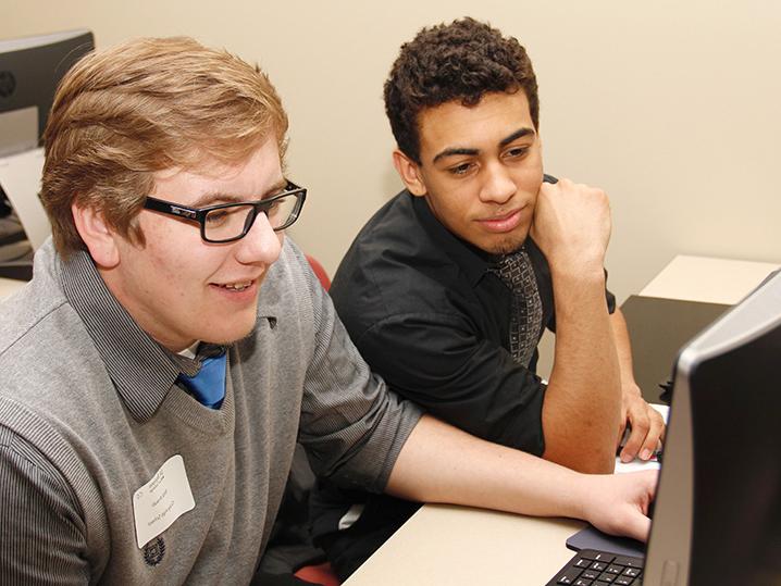 two students working at computer