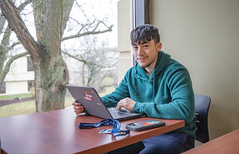 male student with laptop